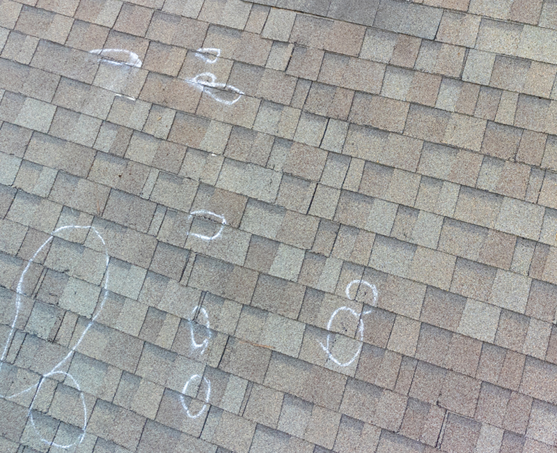 Hail-Damaged Residential Asphalt Roofing.