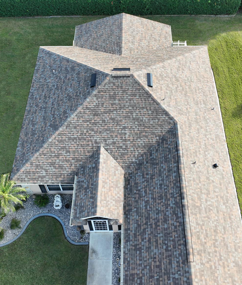 Large, Grey Residential Asphalt Roofing Installation.